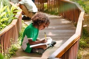 Arbor-School-child-sitting-outside
